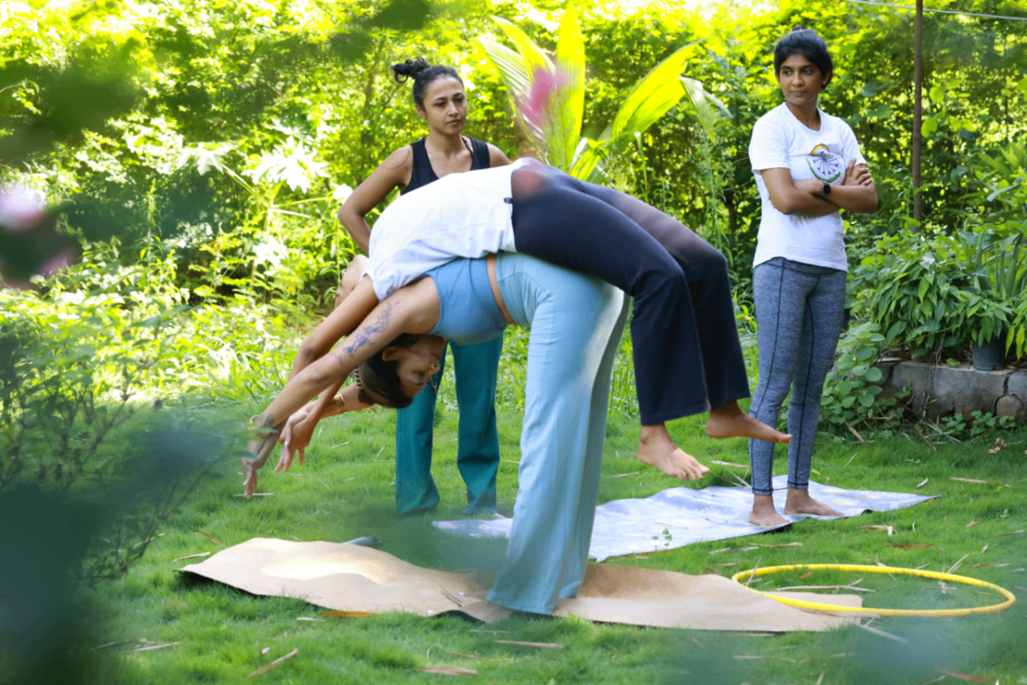 Retreat participants practicing balance and backbend work